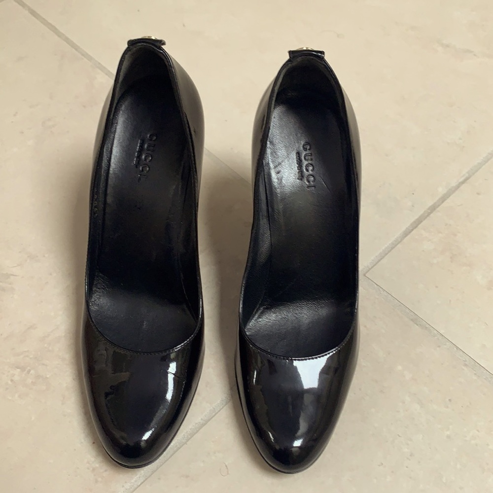 Black patent  leather Gucci pumps.